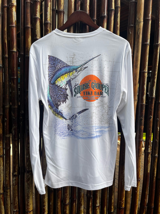 A long sleeve white tech fabric tee-shirt with a colorful sailfish design on the back and the Square Grouper logo along with a a nautical chart background. Displayed on a wooden hanger against a bamboo backdrop. 